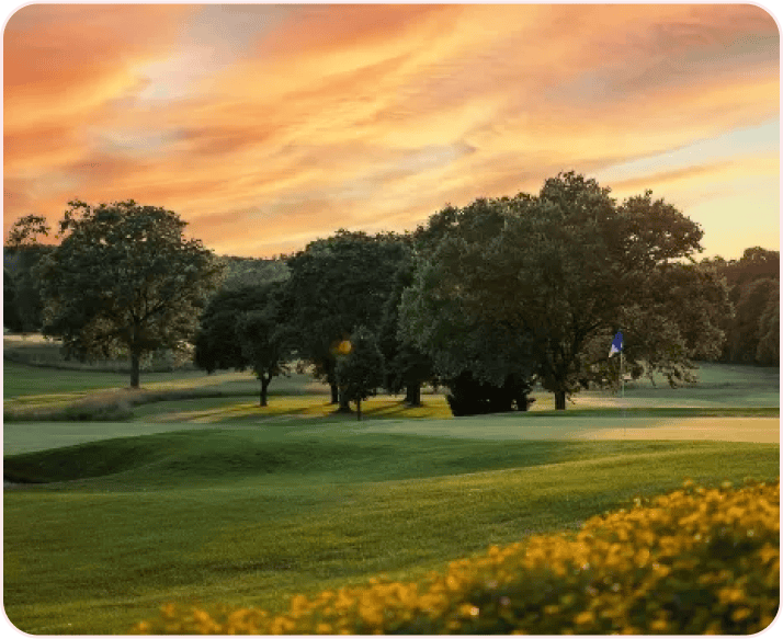 Sunset over a golf course green